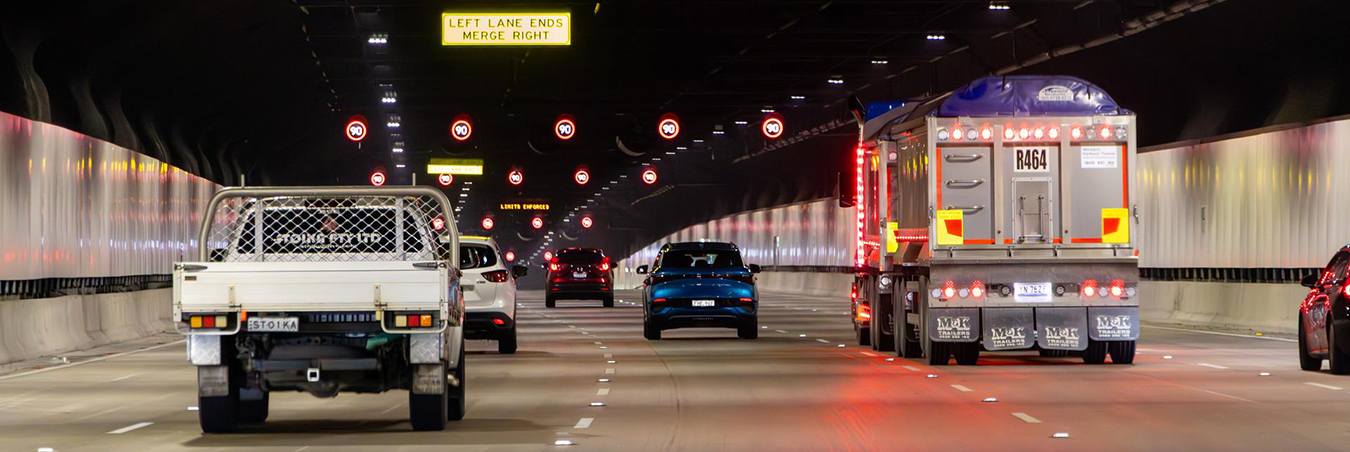 Cars and trucks driving through a tunnel
